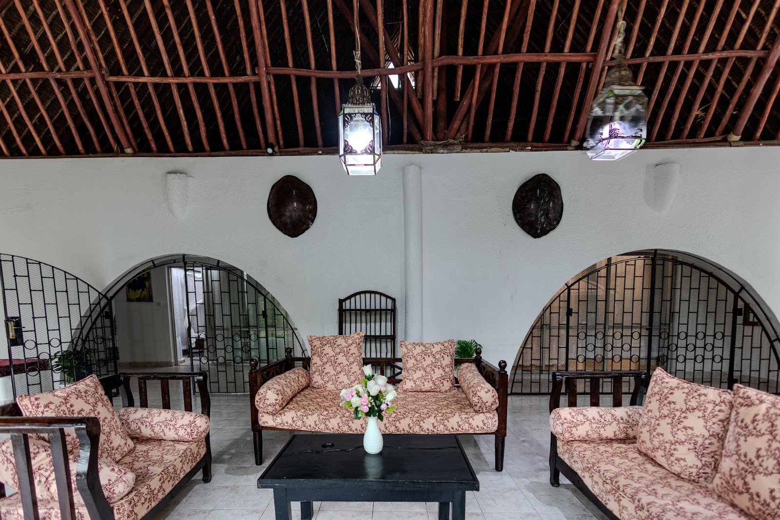 Arched open living pavilion with cushioned seating