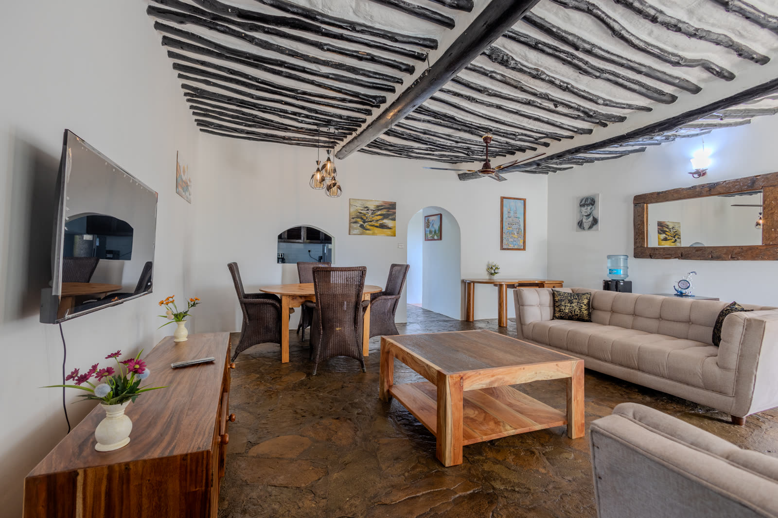 Dining table and lounge seating in the three-bedroom villa